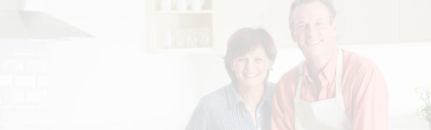 Elderly couple smiling jovially