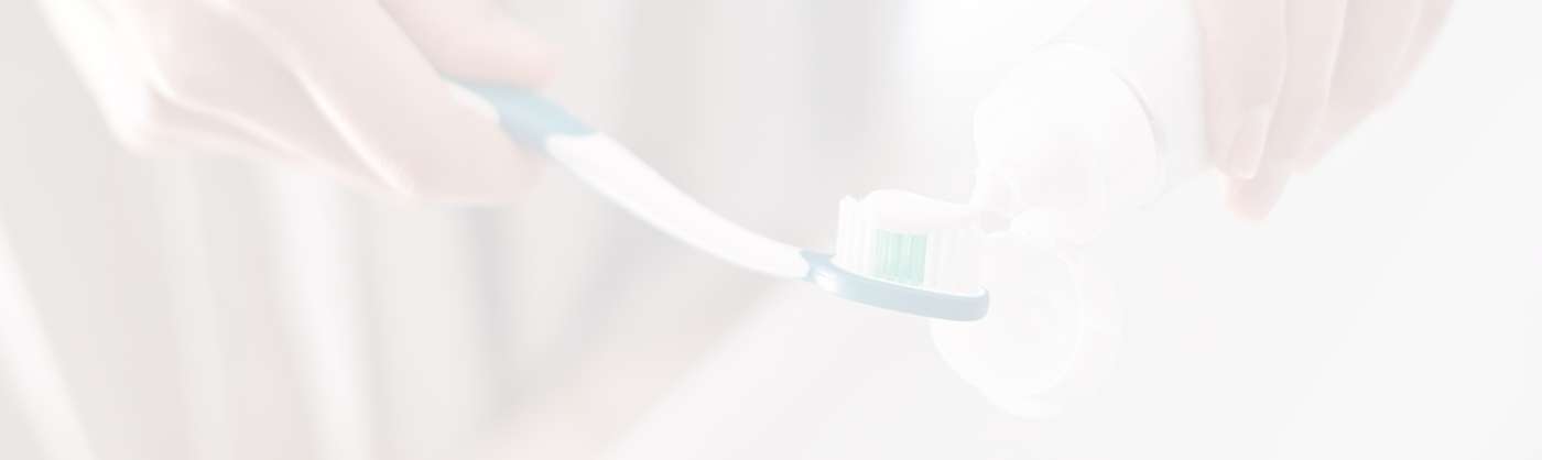 Fayetteville Preventive Dentistry person holding toothbrush and toothpaste