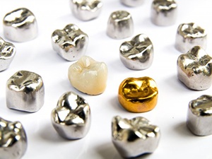several dental crowns made of various materials 