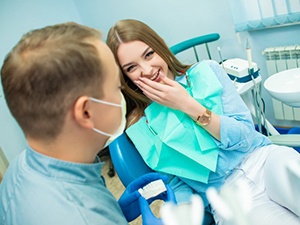 young woman smiling with her dentist 