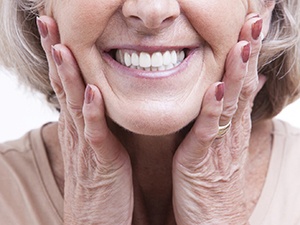 Senior woman smiling with dentures in Fayetteville, NY