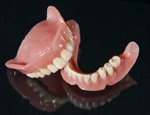 dentures on a black background