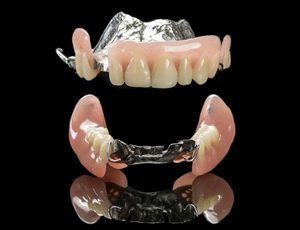 partial dentures on a black background