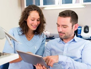 A dentist discussing with a patient