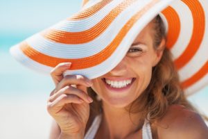 smiling woman with sun hat