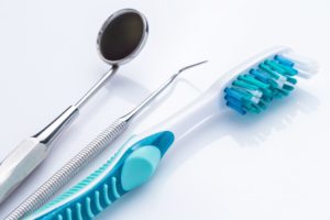Toothbrush and dental instruments from dentist in Fayetteville. 