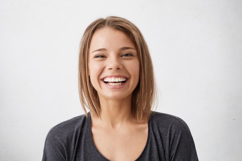 person wearing temporary veneers smiling